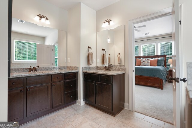 372 Abbington Way, Clarkesville, GA 30523 - ensuite bathroom with two vanities, healthy amount of natural light, tile patterned flooring, and baseboards
