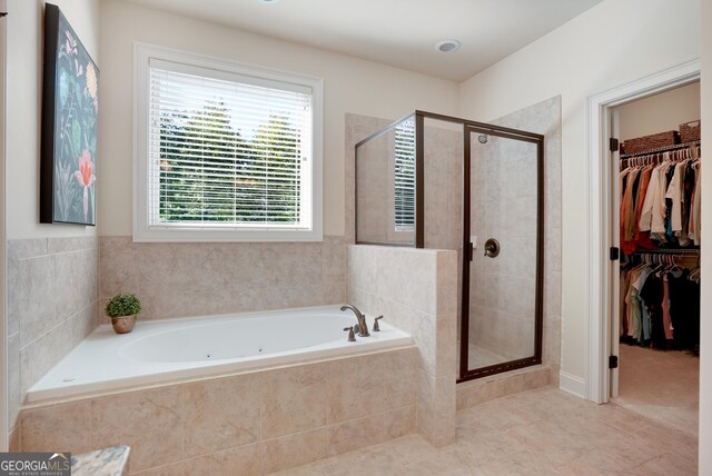 372 Abbington Way, Clarkesville, GA 30523 - full bath featuring a jetted tub, a stall shower, tile patterned flooring, and a walk in closet