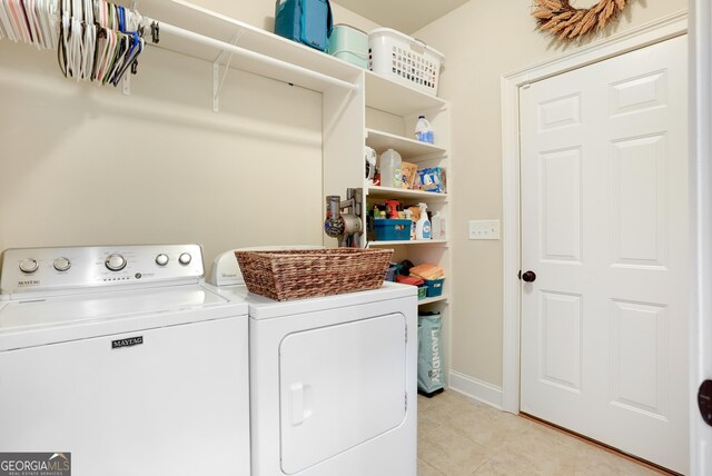 372 Abbington Way, Clarkesville, GA 30523 - laundry area with washer and dryer and light tile patterned floors