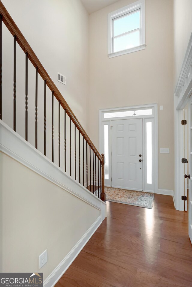 372 Abbington Way, Clarkesville, GA 30523 - entrance foyer with a towering ceiling, wood finished floors, stairs, and baseboards