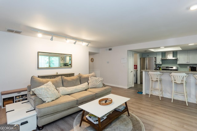 72 Sutton Pl, Avondale Estates, GA 30002 - living room with light wood-type flooring and baseboards