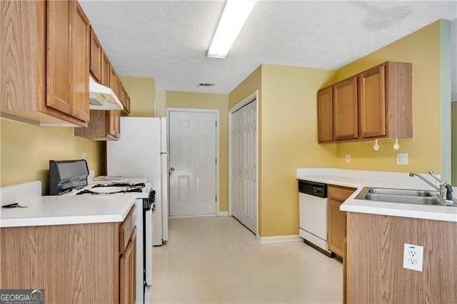 424 Yellow River Walk, Lawrenceville, GA 30043 - kitchen with range with gas stovetop, white dishwasher, a sink, under cabinet range hood, and light countertops