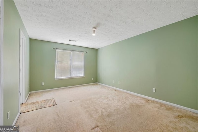 424 Yellow River Walk, Lawrenceville, GA 30043 - unfurnished room featuring carpet floors, a textured ceiling, and baseboards
