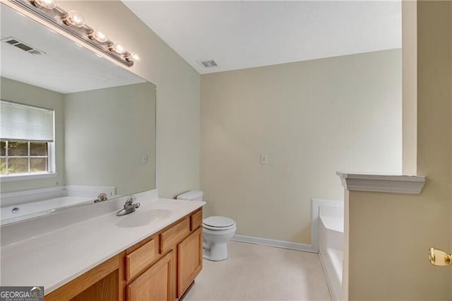 424 Yellow River Walk, Lawrenceville, GA 30043 - full bathroom featuring vanity, a garden tub, toilet, and baseboards