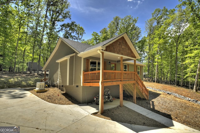 1214 Zenith Trl, Ellijay, GA 30540 - view of front facade with covered porch, roof with shingles, stairway, and crawl space