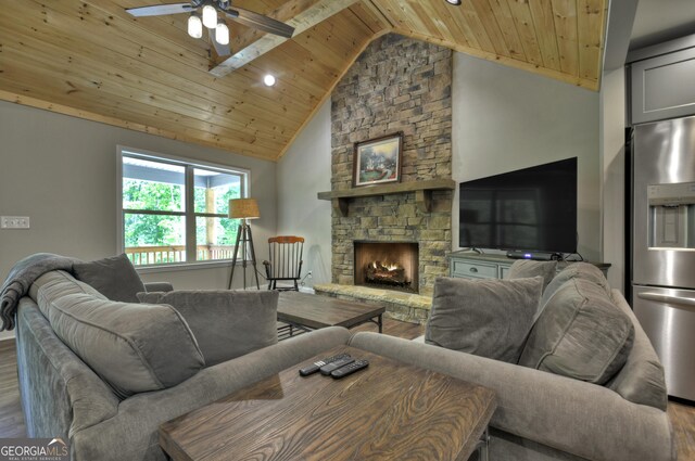 1214 Zenith Trl, Ellijay, GA 30540 - living area featuring wood finished floors, wooden ceiling, a ceiling fan, a stone fireplace, and high vaulted ceiling