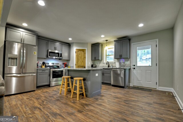 1214 Zenith Trl, Ellijay, GA 30540 - kitchen with stainless steel appliances, gray cabinetry, recessed lighting, dark wood-style flooring, and a kitchen island