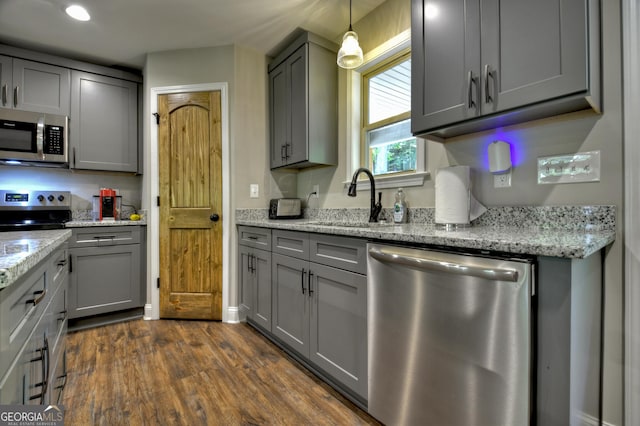 1214 Zenith Trl, Ellijay, GA 30540 - kitchen featuring appliances with stainless steel finishes, a sink, gray cabinets, dark wood finished floors, and light stone countertops