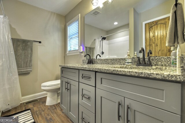1214 Zenith Trl, Ellijay, GA 30540 - bathroom with double vanity, baseboards, toilet, wood finished floors, and curtained shower