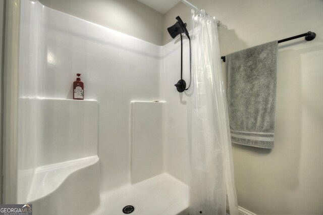 1214 Zenith Trl, Ellijay, GA 30540 - bathroom featuring a shower with curtain