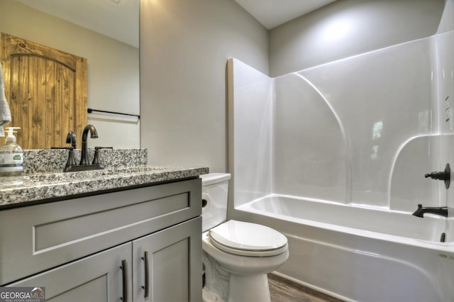 1214 Zenith Trl, Ellijay, GA 30540 - bathroom with vanity, wood finished floors, toilet, and shower / washtub combination