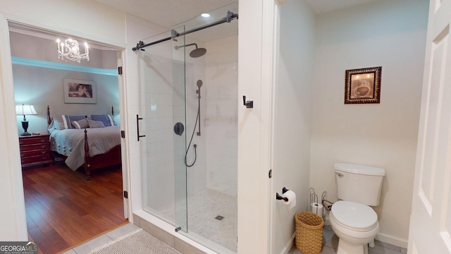 2884 Overwood Ln, Snellville, GA 30078 - ensuite bathroom featuring a stall shower and a chandelier