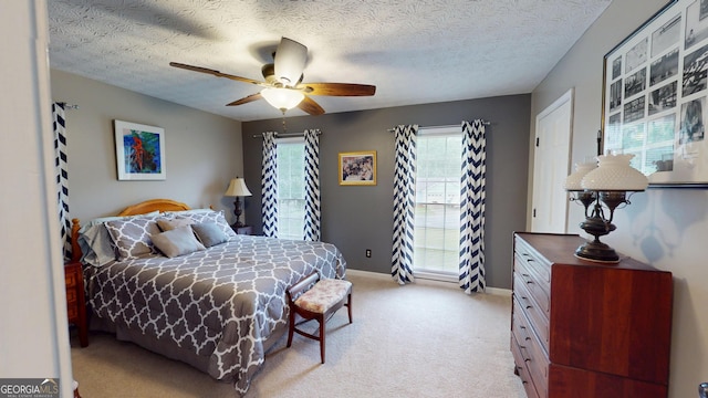 2884 Overwood Ln, Snellville, GA 30078 - bedroom with light carpet, a ceiling fan, and a textured ceiling