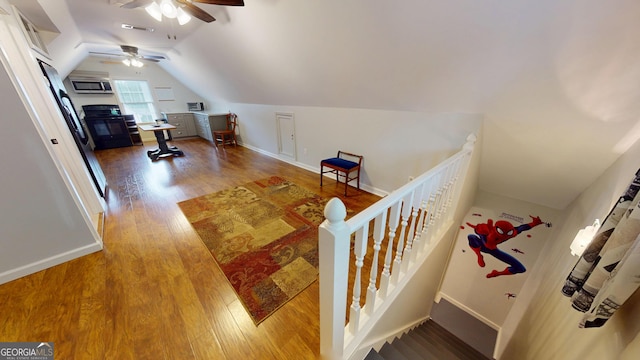2884 Overwood Ln, Snellville, GA 30078 - staircase featuring wood finished floors, ceiling fan, and lofted ceiling