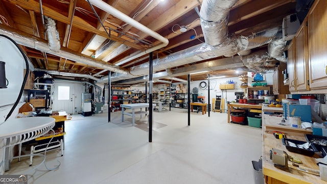 2884 Overwood Ln, Snellville, GA 30078 - basement featuring water heater and a workshop area