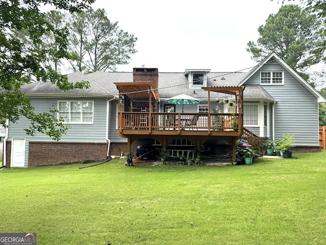 2884 Overwood Ln, Snellville, GA 30078 - rear view of property featuring a wooden deck, a lawn, a chimney, and a shingled roof