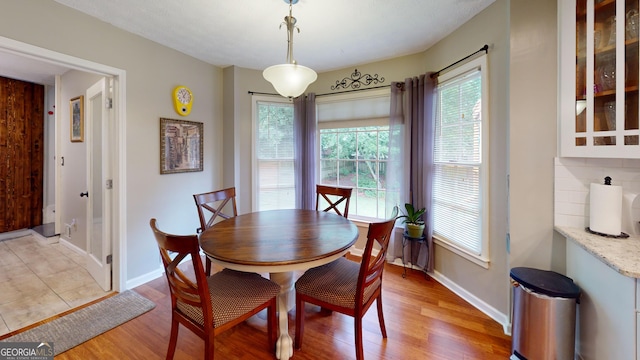 2884 Overwood Ln, Snellville, GA 30078 - dining space with light wood-style floors and healthy amount of natural light