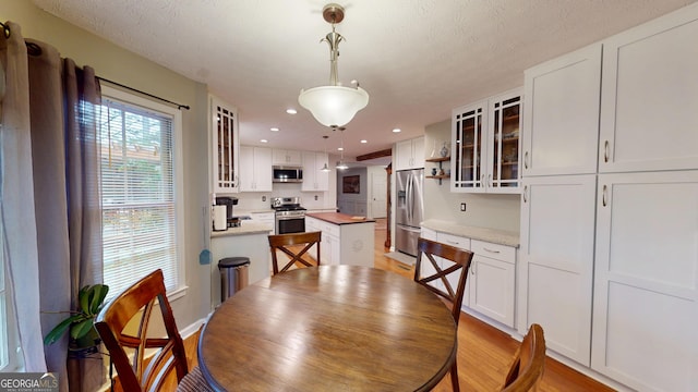 2884 Overwood Ln, Snellville, GA 30078 - dining area with light wood-style floors and recessed lighting