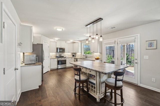 6024 Park Bay Ct, Flowery Branch, GA 30542 - dining space with dark wood-style floors and baseboards