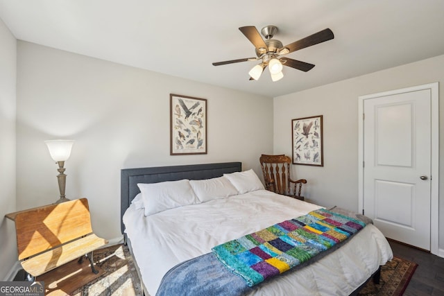 6024 Park Bay Ct, Flowery Branch, GA 30542 - bedroom with dark wood-style floors and ceiling fan