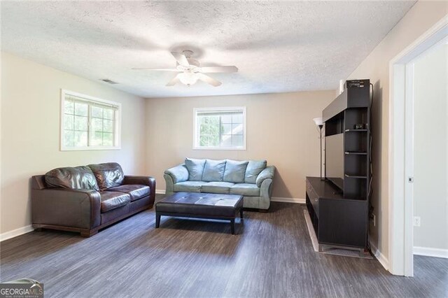 2577 Abbotts Glen Dr NW, Acworth, GA 30101 - living area featuring a ceiling fan, dark wood-type flooring, and a textured ceiling