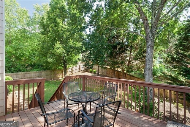 2577 Abbotts Glen Dr NW, Acworth, GA 30101 - deck with outdoor dining area and a fenced backyard