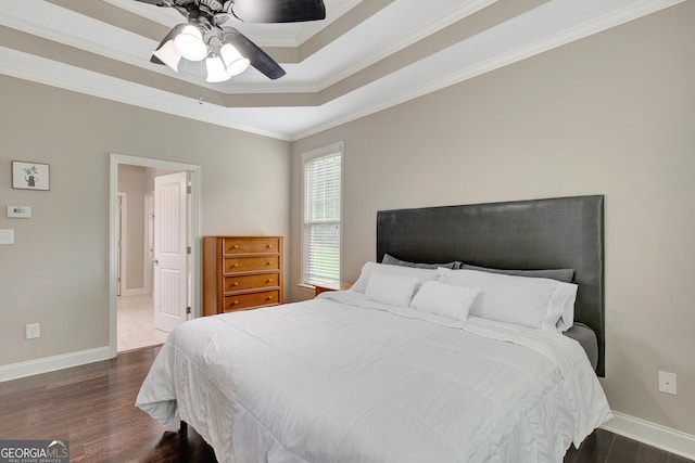 108 Hidden Springs Dr, Lagrange, GA 30240 - bedroom featuring ornamental molding, dark wood-style flooring, a tray ceiling, and a ceiling fan
