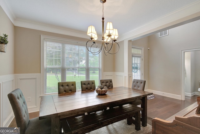 108 Hidden Springs Dr, Lagrange, GA 30240 - dining room with a chandelier, crown molding, plenty of natural light, a wainscoted wall, and wood finished floors