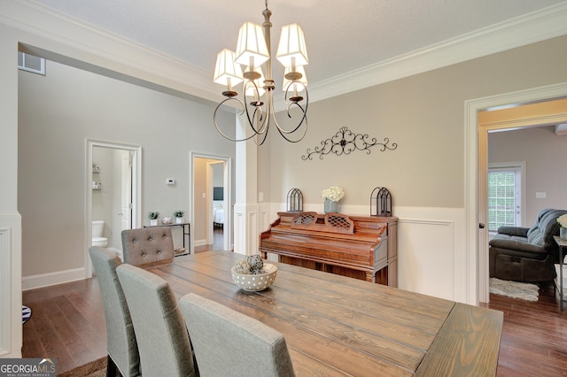 108 Hidden Springs Dr, Lagrange, GA 30240 - dining area with a chandelier, ornamental molding, dark wood finished floors, and a wainscoted wall