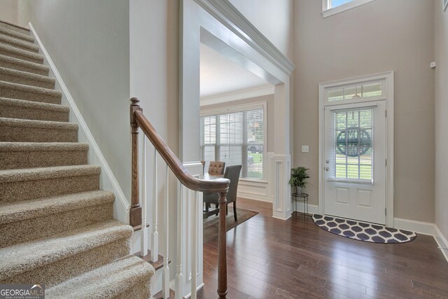 108 Hidden Springs Dr, Lagrange, GA 30240 - foyer featuring healthy amount of natural light, wood finished floors, stairway, and wainscoting