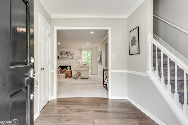 5548 Fitzpatrick Trce, Peachtree Corners, GA 30092 - foyer with stairs, a fireplace, crown molding, wood finished floors, and baseboards