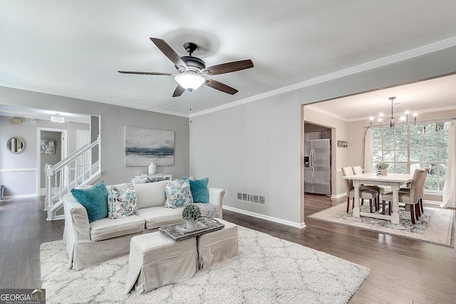 5548 Fitzpatrick Trce, Peachtree Corners, GA 30092 - living room featuring baseboards, a chandelier, stairway, ceiling fan, and crown molding