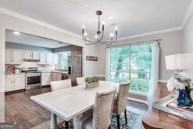 5548 Fitzpatrick Trce, Peachtree Corners, GA 30092 - dining area with a chandelier, dark wood finished floors, healthy amount of natural light, crown molding, and baseboards