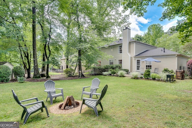 5548 Fitzpatrick Trce, Peachtree Corners, GA 30092 - view of green lawn featuring a fire pit