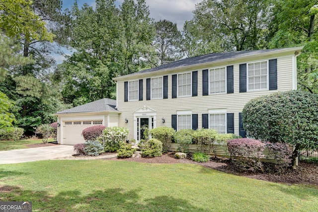 5548 Fitzpatrick Trce, Peachtree Corners, GA 30092 - colonial house with an attached garage, a front yard, driveway, and view of wooded area