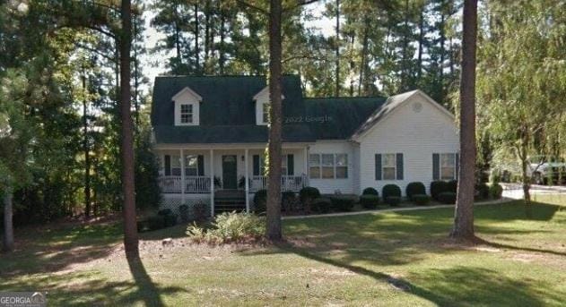 65 Barclay Ct, Newnan, GA 30263 - cape cod home with covered porch and a front yard