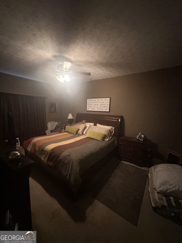 65 Barclay Ct, Newnan, GA 30263 - bedroom featuring a textured ceiling, carpet flooring, and ceiling fan