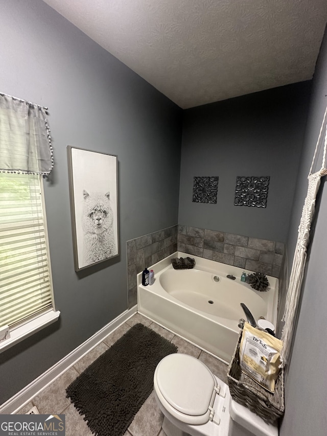 65 Barclay Ct, Newnan, GA 30263 - bathroom with a whirlpool tub, a textured ceiling, and tile patterned floors