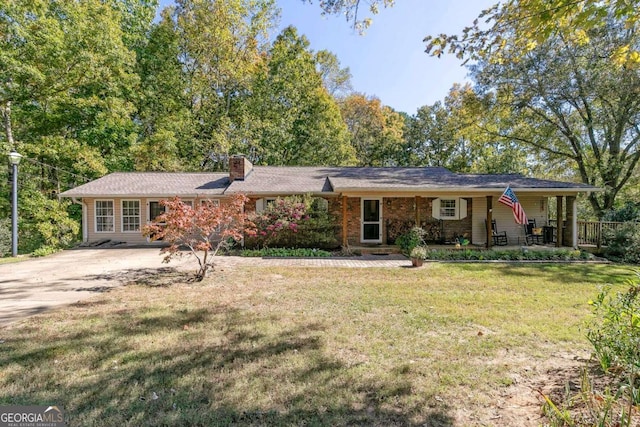 255 Shipp Cir, Hiram, GA 30141 - ranch-style home with driveway, a chimney, a front yard, and covered porch