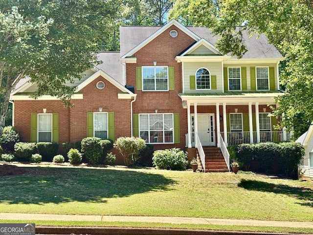 4630 Smokestone Dr, Douglasville, GA 30135 - colonial home featuring brick siding, a front yard, and a porch