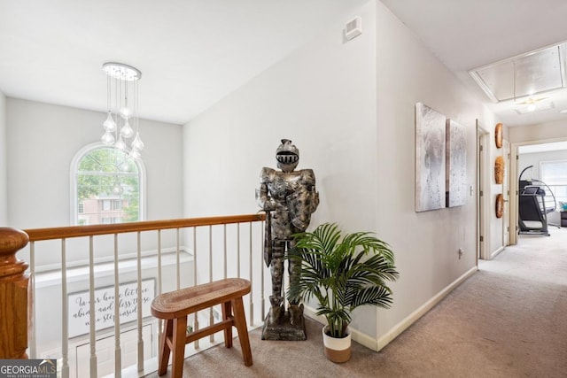 4630 Smokestone Dr, Douglasville, GA 30135 - hallway with attic access, carpet, plenty of natural light, and baseboards