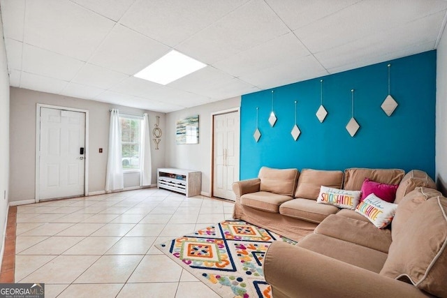 4630 Smokestone Dr, Douglasville, GA 30135 - living room featuring baseboards, light tile patterned floors, and a drop ceiling