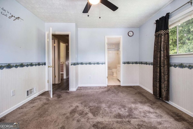 2209 Willoby Ct, Morrow, GA 30260 - unfurnished bedroom with wainscoting, carpet, a textured ceiling, ensuite bath, and ceiling fan