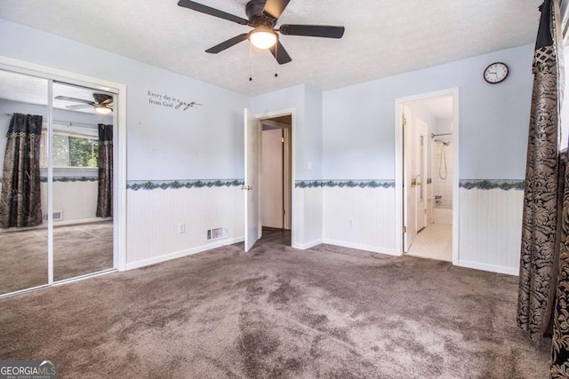 2209 Willoby Ct, Morrow, GA 30260 - unfurnished bedroom with carpet floors, wainscoting, a textured ceiling, connected bathroom, and a closet
