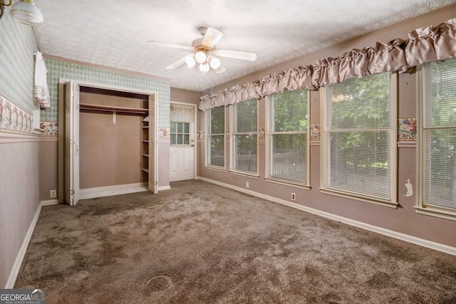 2209 Willoby Ct, Morrow, GA 30260 - unfurnished bedroom featuring carpet floors, baseboards, a closet, a textured ceiling, and a ceiling fan