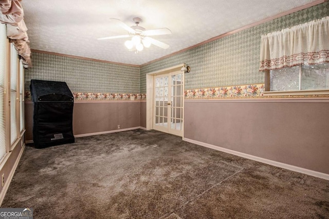 2209 Willoby Ct, Morrow, GA 30260 - spare room with ceiling fan, ornamental molding, a wainscoted wall, wallpapered walls, and carpet floors