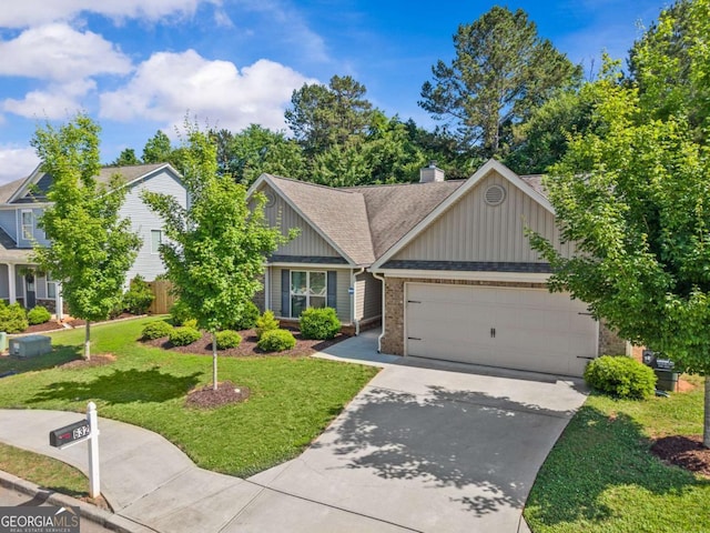 632 Holly Springs Ct, Athens, GA 30606 - view of front of home with board and batten siding, driveway, a garage, and a front lawn