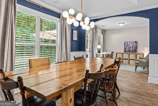 632 Holly Springs Ct, Athens, GA 30606 - dining room with arched walkways, plenty of natural light, wainscoting, ornamental molding, and wood finished floors