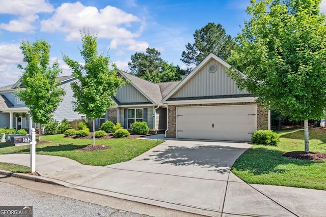 632 Holly Springs Ct, Athens, GA 30606 - view of front of house with brick siding, a garage, a front lawn, and driveway
