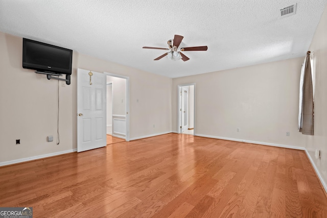 1206 Zittrouer Rd, Guyton, GA 31312 - unfurnished living room with a ceiling fan, light wood-type flooring, a textured ceiling, and baseboards